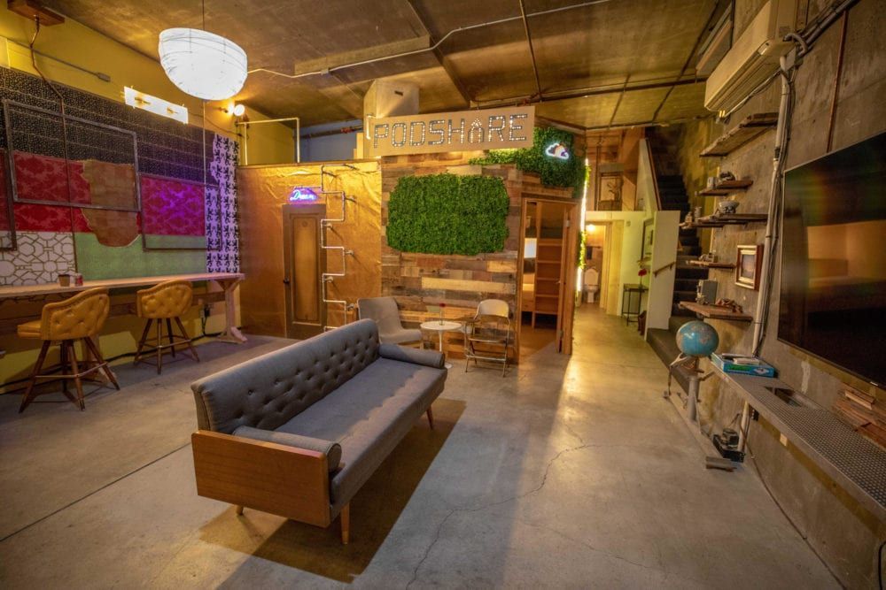 Eclectic living space with gray couch.