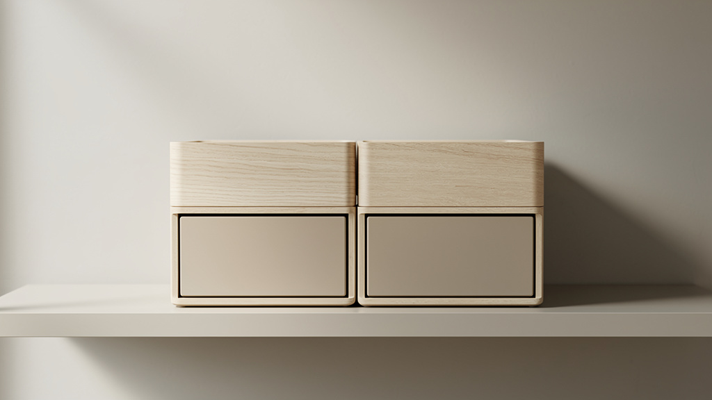 A symmetrical stack of light wood and sand-toned modular organizers on a neutral shelf, lit by soft natural daylight.
